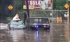 NJ Police Use Humvee to Rescue Bride And Groom Stranded in Flooded Car