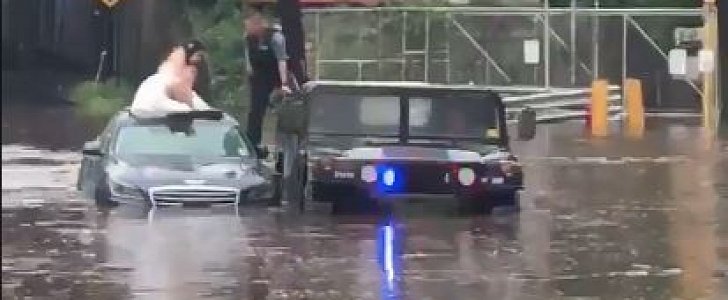 NJ cops use a Humvee to rescue stranded bride and groom from the floods