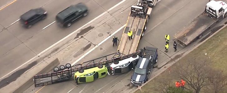 Trailer hauling a pair of Ford Mustang Shelby GT500s flips on the highway