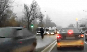 Overly-Zealous Russian Cop Uses Foot to Stop Car - Fails