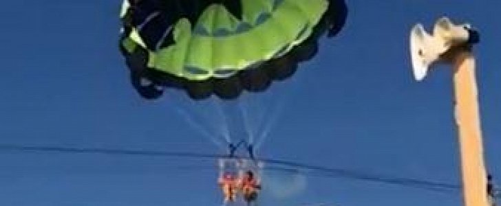 Couple become tangled in live power cables during parascending ride in Russia