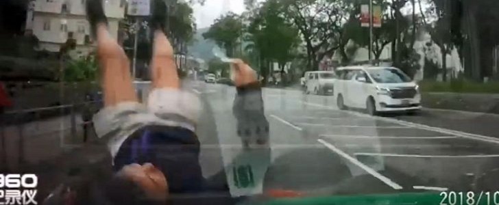 Schoolgirl is thrown in the air after being hit by a taxi in Hong Kong