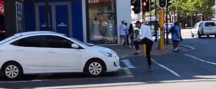 Prankster tricks driver on pedestrian crossing in viral video