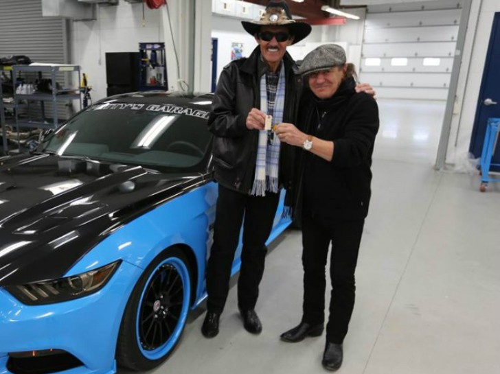 AC/DC's Brian Johnson and Richard Petty next to the Petty's Garage Mustang GT