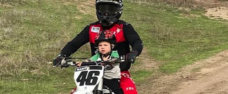 Carey Hart rides a dirt bike with 2-year-old son Jameson