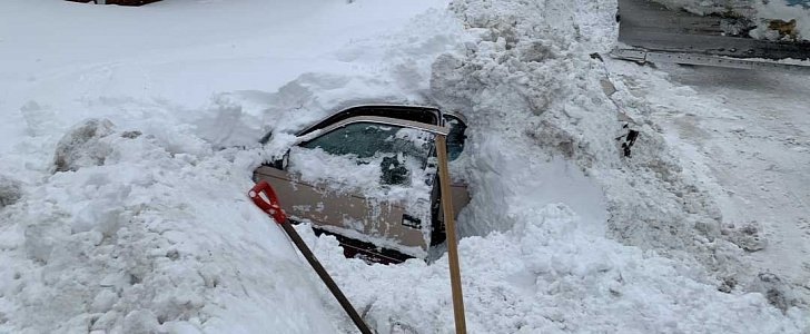 Snowplow bumps into car covered in snow, police find woman alive and well inside