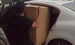 “Porch Pirate” Struggles to Fit Large Box in Backseat of Getaway Car