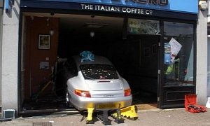 Porsche 911 Crashes into Coffee Shop, Traps Two Customers