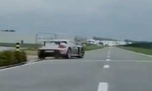 Porsche Carrera GT Drifts Exiting a Parking Lot with Hair-Raising V10 Engine Sound