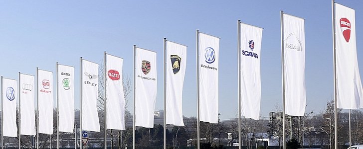 Flags with the brands of the Volkswagen Group in front of company headquarters