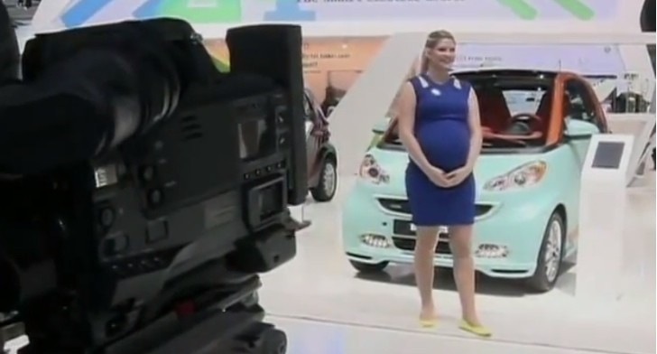 Pregnant woman at 2014 Detroit Auto Show