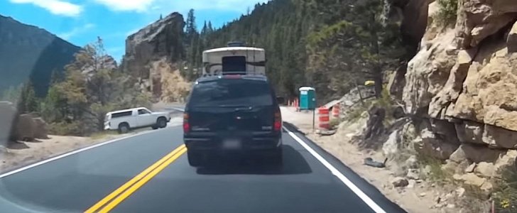 Chevy truck rolls down cliff while driver is using the port-a-potty