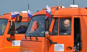 Putin Drives a Truck over New Crimea Bridge, Army of Trucks Follow
