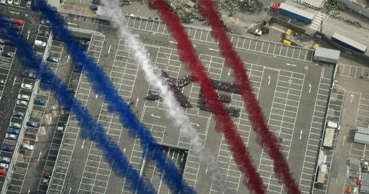 Red Arrows fly over Jaguar factory