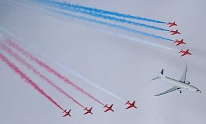 RAF’s Red Arrows Flank the Mighty Submarine-Hunter Poseidon in Joint Flypast