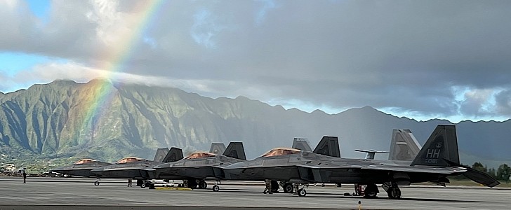 Four F-22 Raptors and one rainbow