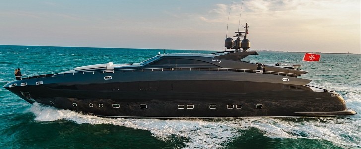 Rock 13 is a head-turning black luxury yacht with a sporty silhouette