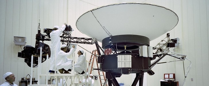 Engineers preparing the Voyager 2 spacecraft ahead of its launch