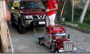 Remote Control Toy Truck Tows a Nissan SUV