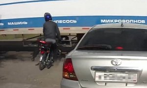 Rider Forgets to Brake, Violently Clipped by Fast, Huge Truck but Walks Away – Video