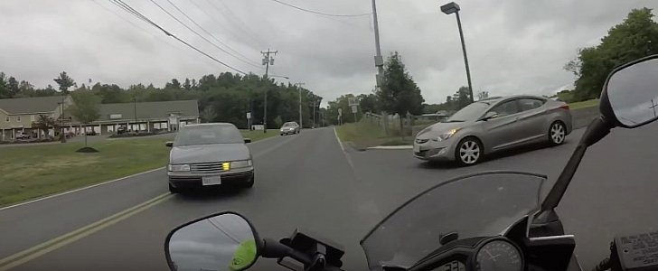 Motorcycle swerves around car
