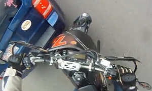 Rider Manages to Slow Down before Crashing into SUV
