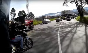 Rider Merges Into Dense Traffic Too Hot, Manages Not To Crash