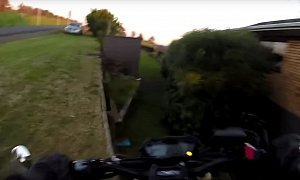 Rider Misses Turn, Falls Into Someone's Backyard