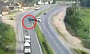 Rider Slides under Truck to Miraculously Tell the Story