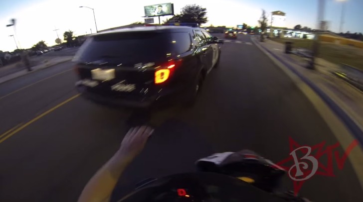Rider preparing to sticker slap a police car
