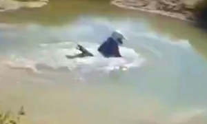 Rider Tests River Depth with Bike