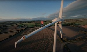 Riding Your Bike on the Blade of a Wind Turbine Is How You Advocate for Climate Change