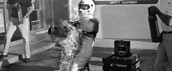 Iconic image of Bill Simpson setting himself on fire to illustrate the properties of his Nomex suit