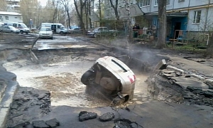 Road Swallows Another Car in Russia