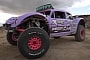 Monster Buggy Drag Races Trophy Truck, Hopes It Can Win Using the Magic Spray