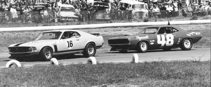 George Follmer in the Ford Mustang Boss 302 leads the Plymouth Barracuda driven by Dan Gurney in the 1970 Trans-Am Championship race at Laguna Seca