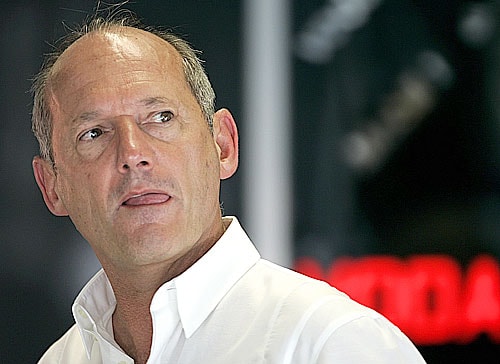 Ron Dennis pleaded guilty to running red light