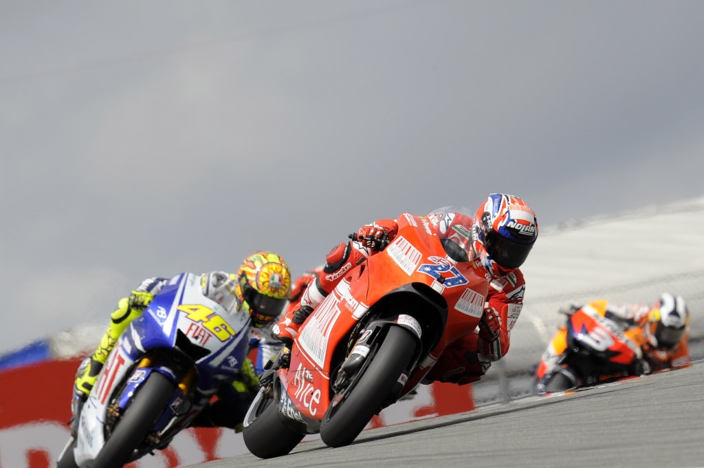 Rossi battles with Stoner during the German GP