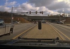 Runaway Truck Wheel Smashes a Police Cruiser's Windscreen, It's All on Video