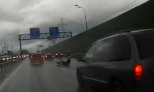 Russian Biker Spills on Wet Road, Crashes One More Bike