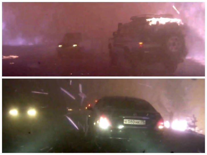 Cars driving through wildfire in Chita, Russia