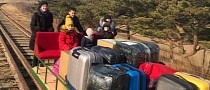 Russian Diplomats Use Hand-Pushed Trolley to Exit North Korea