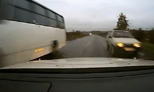 Russian Driver Squeezes Through Impossibly Small Gap
