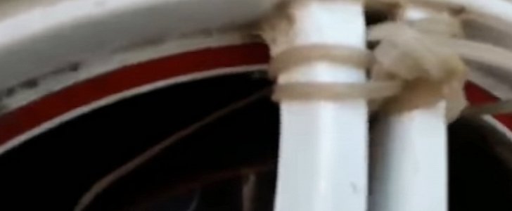 Russian man finds grenade zip-tied to his wheel
