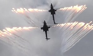Russian Military Helicopter Display Team Shoots Fireworks, Flies in Close Formation