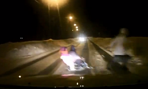 Russian Mom Crosses Road Inappropriately With Two Kids on Sleigh