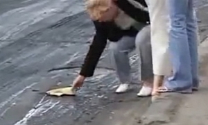 Russian Pedestrians Lose Their Shoes On Freshly Paved Road