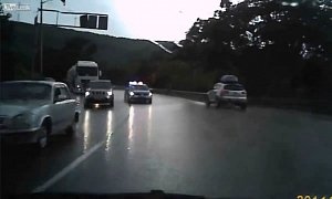 Russian Police Car Going the Wrong Way, Causes Driver to Crash