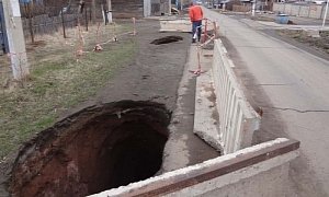 Russian Pothole Claims The Truck That Shows Up To Fix It, Everyone's OK