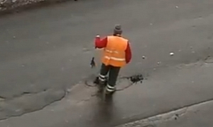 Russian Road Workers Show Us How Not to Patch Up Potholes